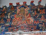 Lo Manthang Thubchen 04-2 Entrance Above Door Painting Of Buddha A smaller painting of golden Buddha in the teaching mudra is above the assembly hall entrance door at Thubchen Gompa in Lo Manthang.